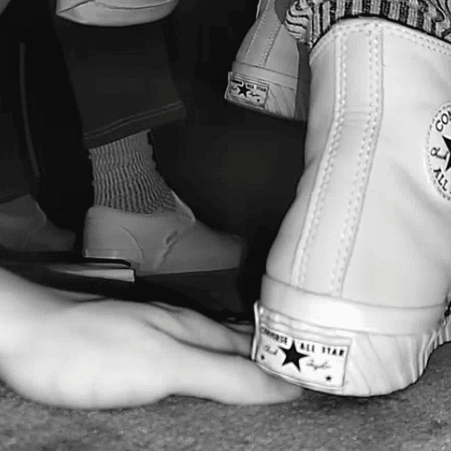 Woman in high-top Converse unaware hand trample + sneaker unaware hand trample 2