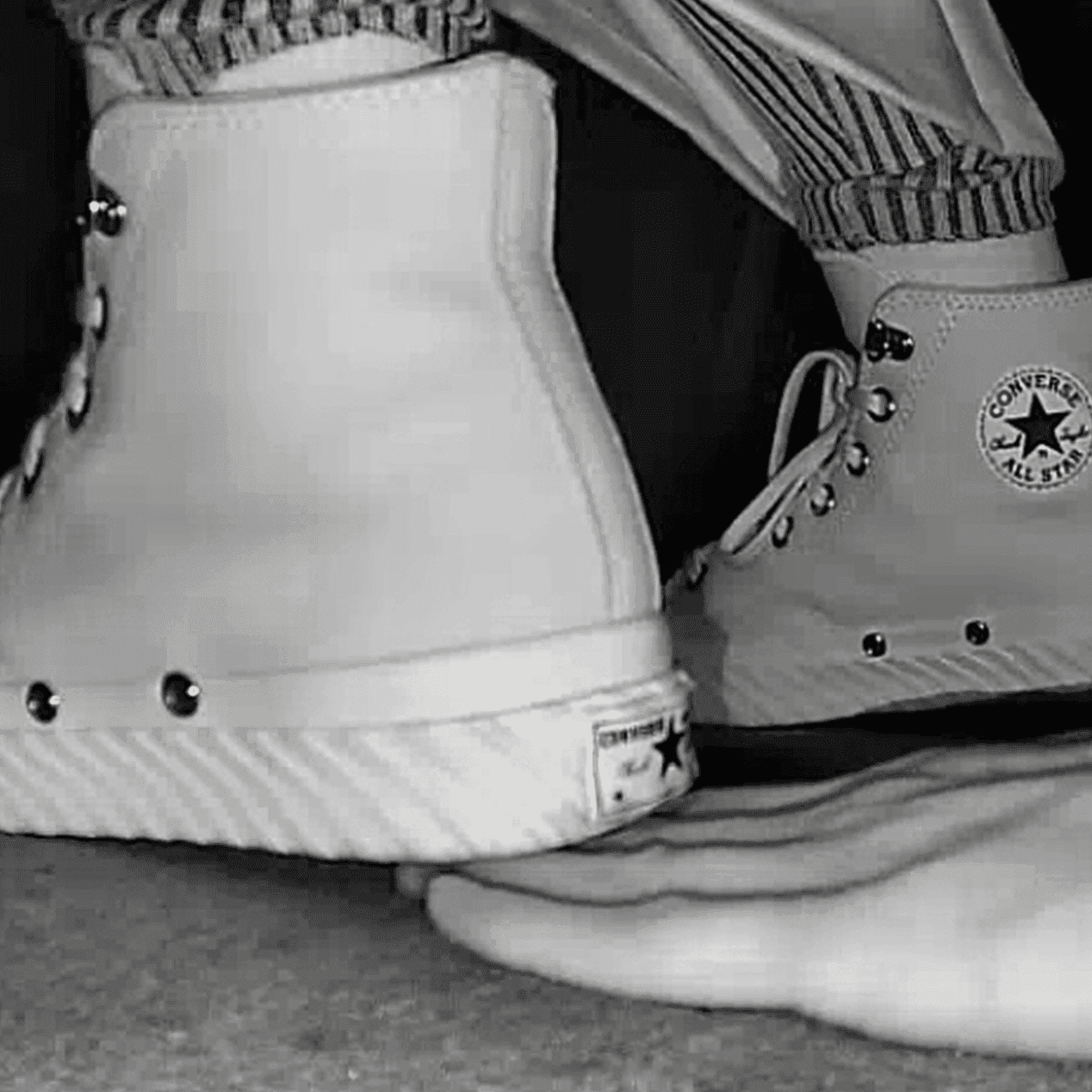 Woman in high-top Converse unaware hand trample + sneaker unaware hand trample thumb 3
