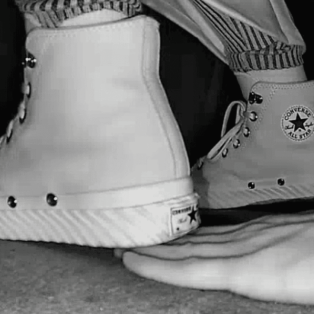 Woman in high-top Converse unaware hand trample + sneaker unaware hand trample 3