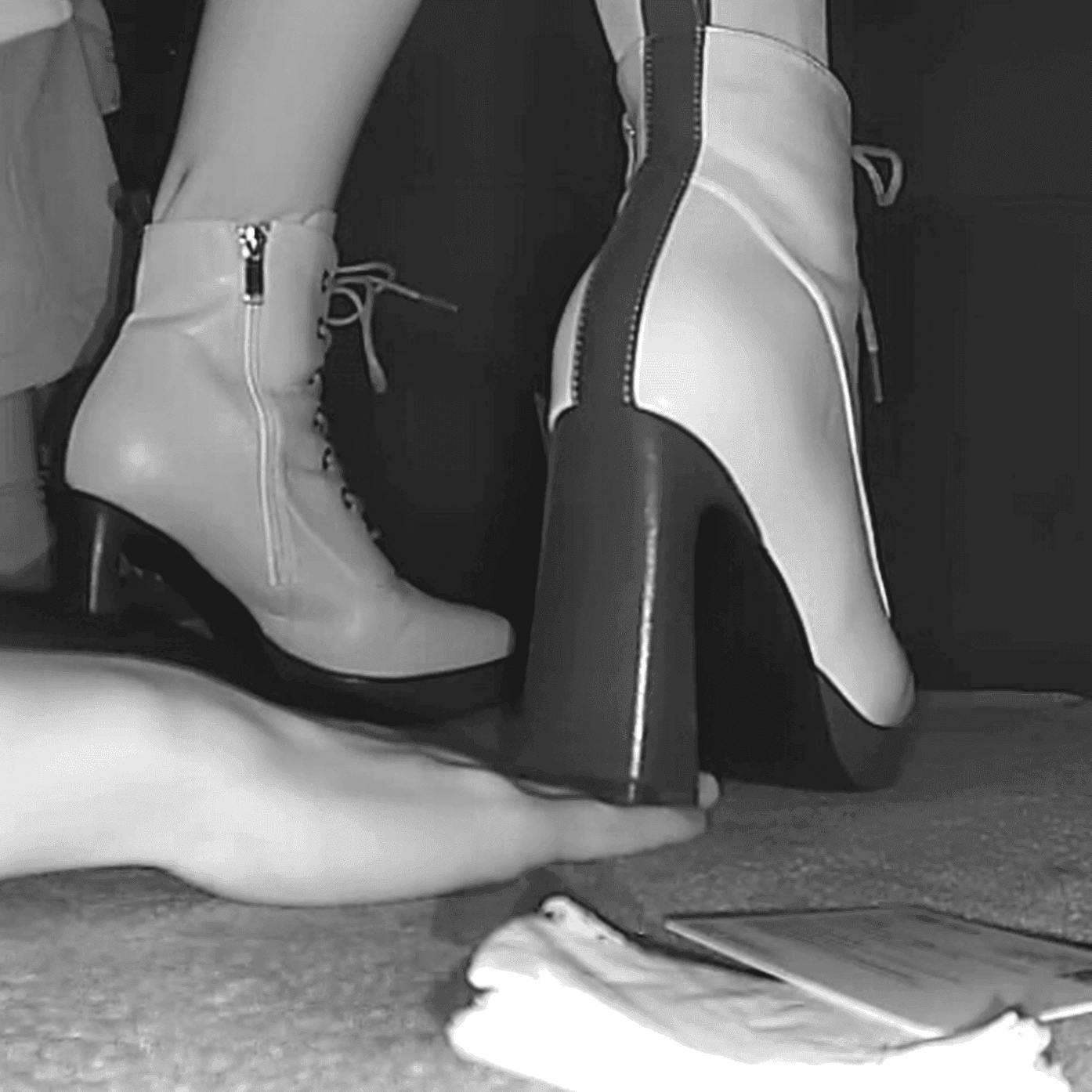 Woman unaware hand trample with 8cm heeled boots in cinema