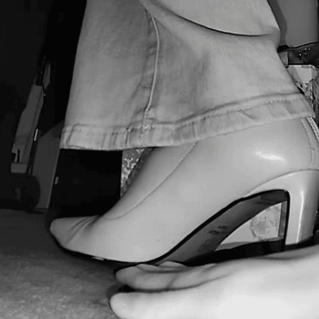 Woman unaware hand trample with high heels and ankle boots in movie theater 3