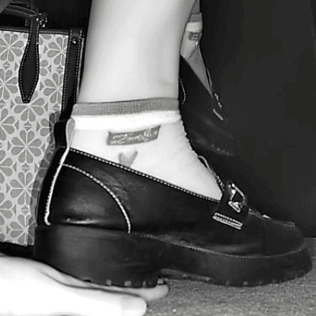 Woman in cinema unaware hand trample with leather shoes 3
