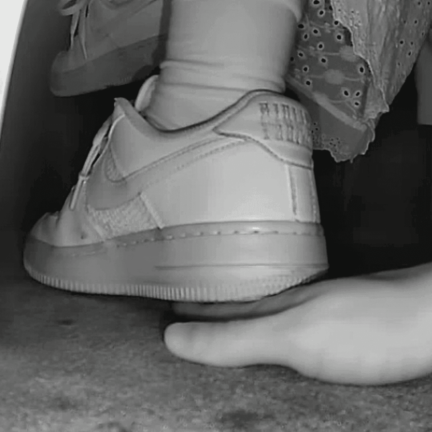 Woman in long skirt and white Nike Air Force sneaker unaware hand trample at the cinema thumb 2
