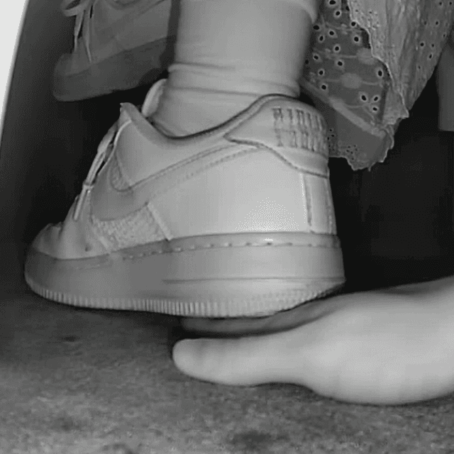 Woman in long skirt and white Nike Air Force sneaker unaware hand trample at the cinema 2