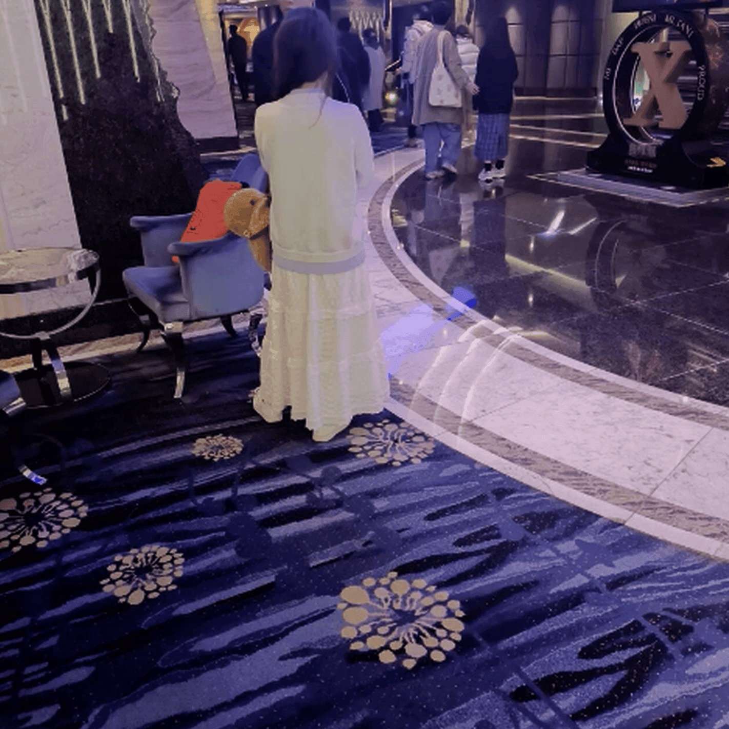 Woman in long skirt and white Nike Air Force sneaker unaware hand trample at the cinema thumb 3