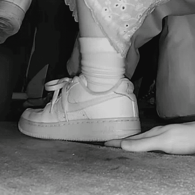 Woman in long skirt and white Nike Air Force sneaker unaware hand trample at the cinema 1