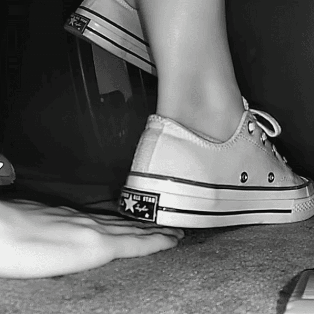 Woman in cinema wearing flat shoes + low-top Converse shoes unaware hand trample 2