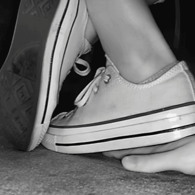 Woman in cinema wearing flat shoes + low-top Converse shoes unaware hand trample 1