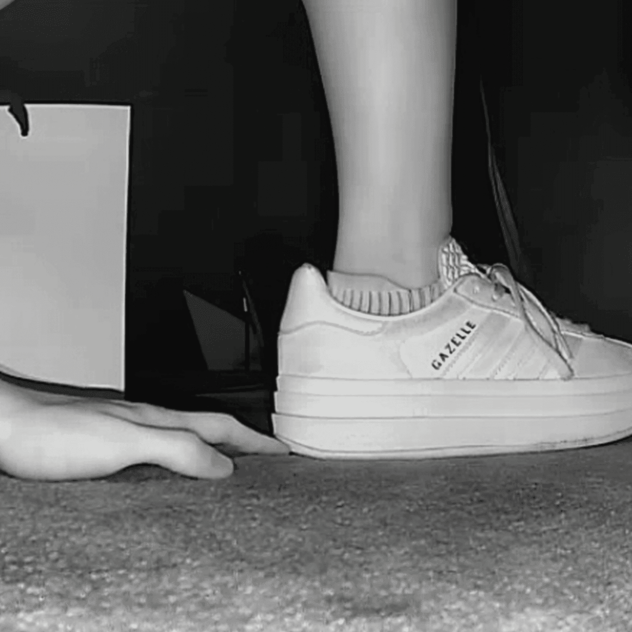 Woman unaware hand trample with sneakers and ankle boots in cinema thumb 2