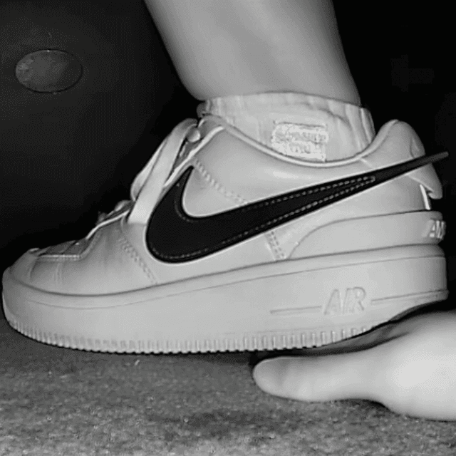 Woman in cinema unaware hand trample with Nike Air Force 1 sneakers 1
