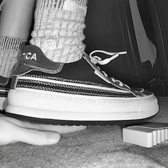 Woman in canvas shoes unaware hand trample in cinema 2
