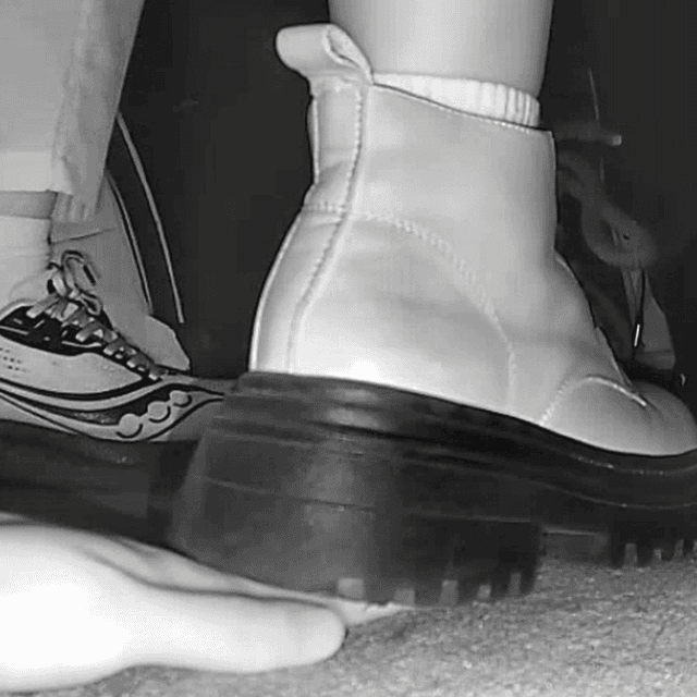 Woman in white socks and Martin boots unaware hand trample in cinema 1