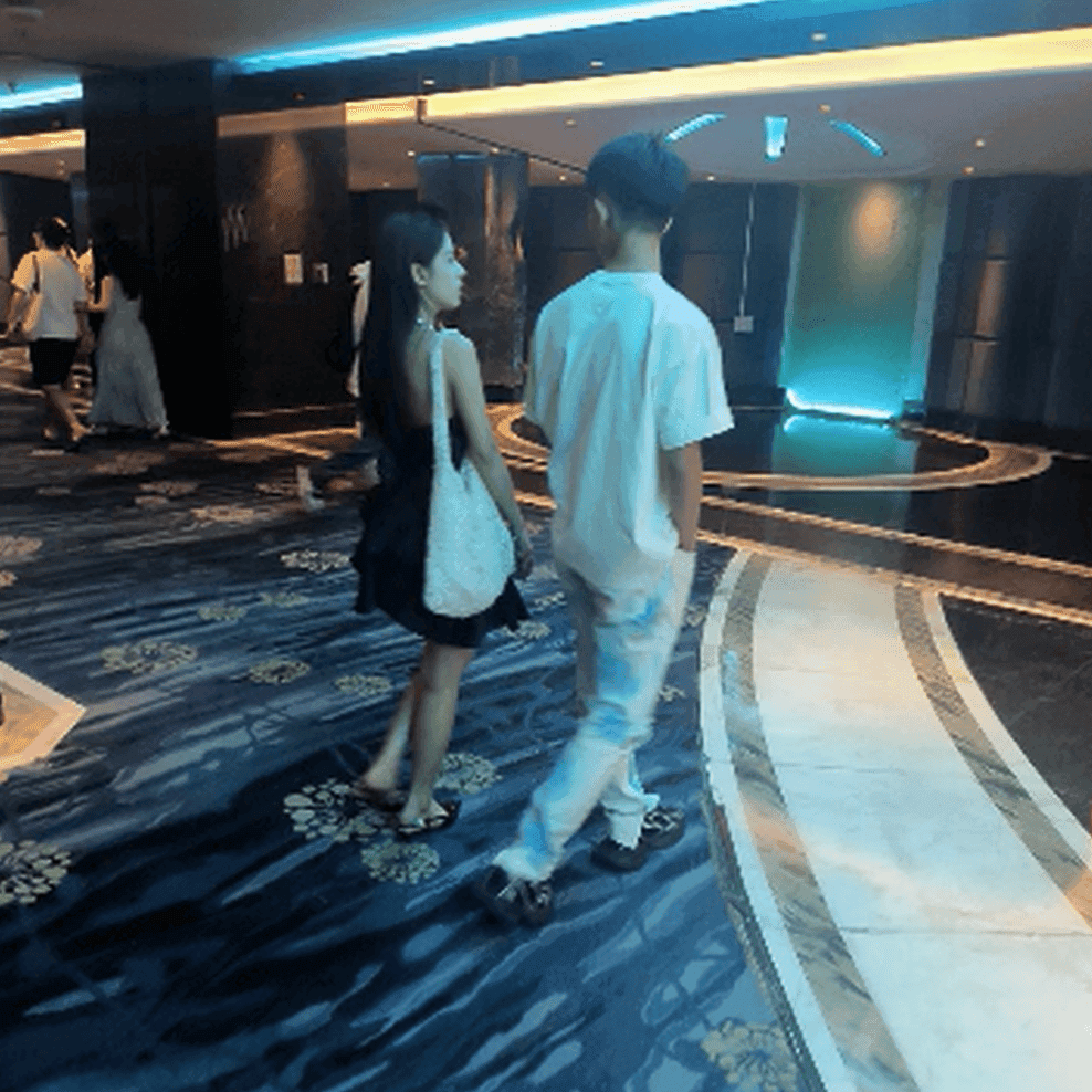 Women in movie theater unaware hand trample with black heels thumb 2