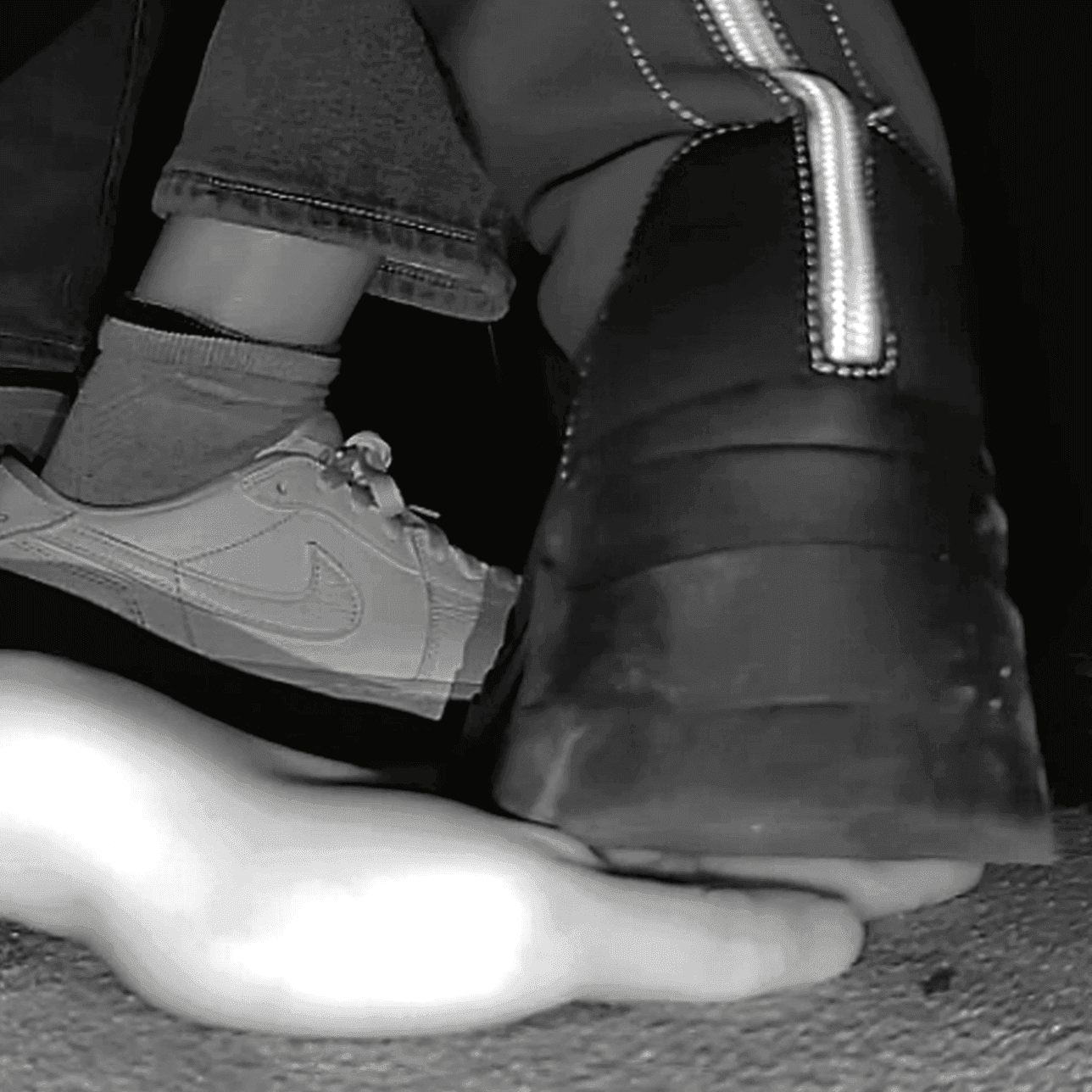 Woman with chunky-heeled knee-high boots unaware hand trample in cinema thumb 4