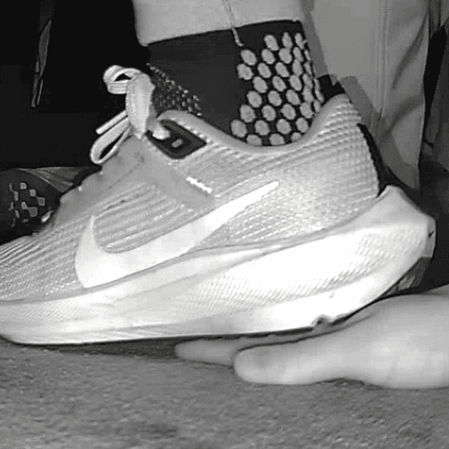 Young woman unaware hand trample with Nike running shoes in cinema 5