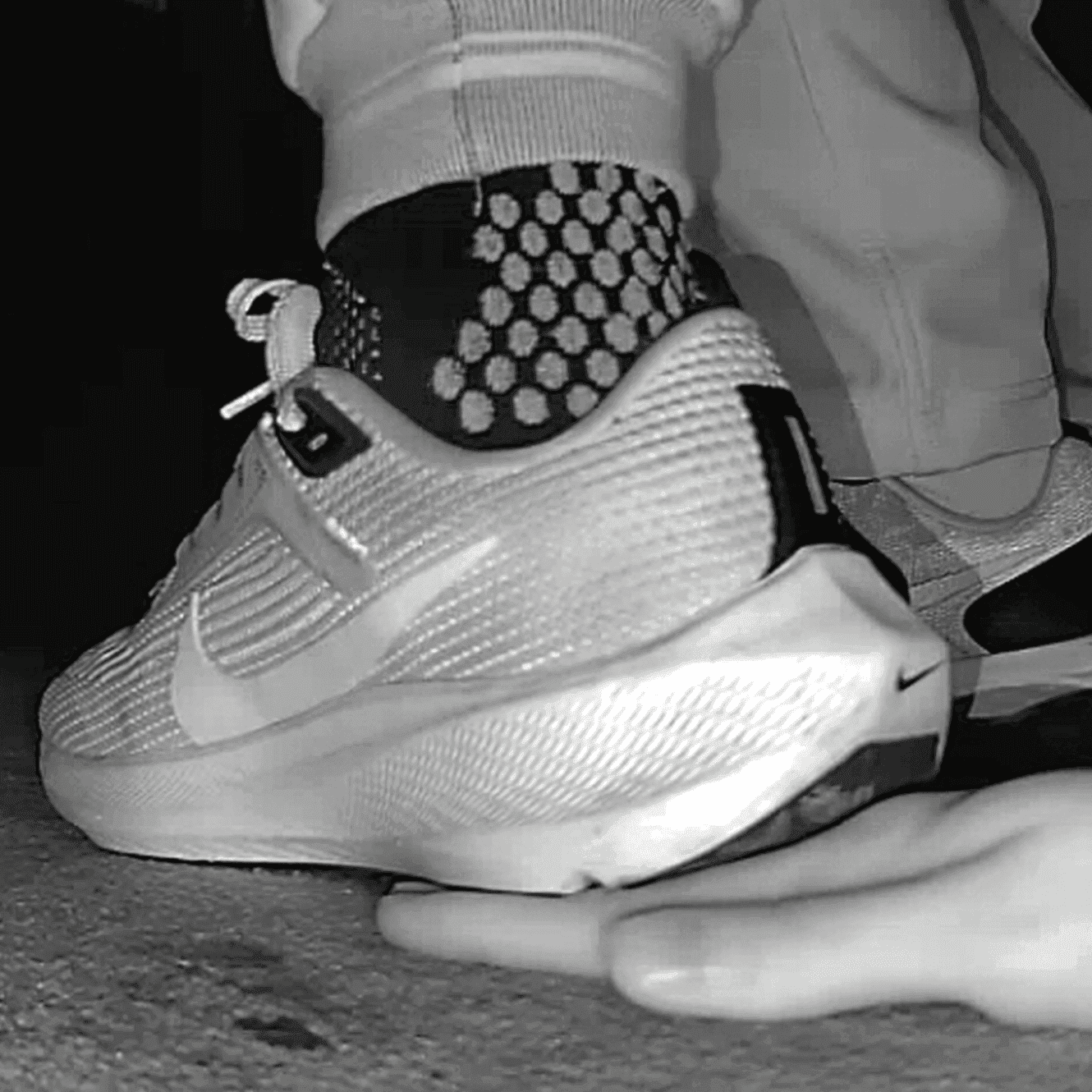 Young woman unaware hand trample with Nike running shoes in cinema thumb 4