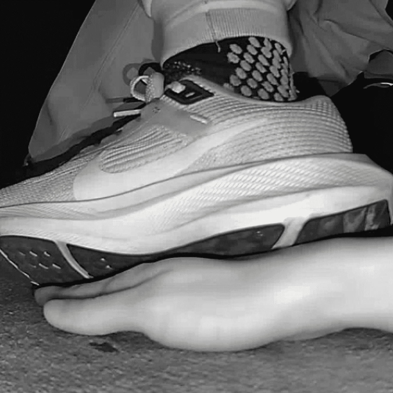 Young woman unaware hand trample with Nike running shoes in cinema thumb 3