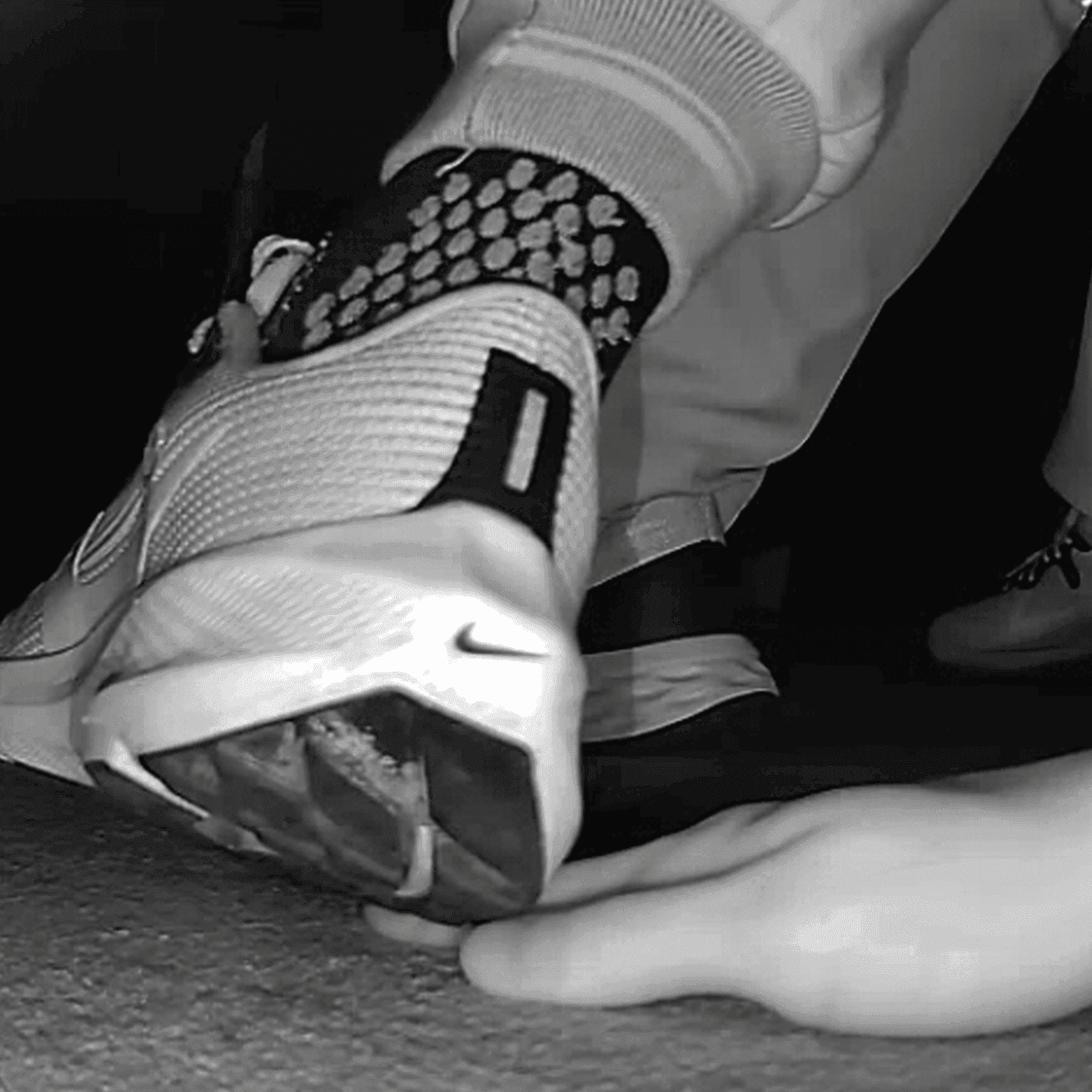 Young woman unaware hand trample with Nike running shoes in cinema thumb 2