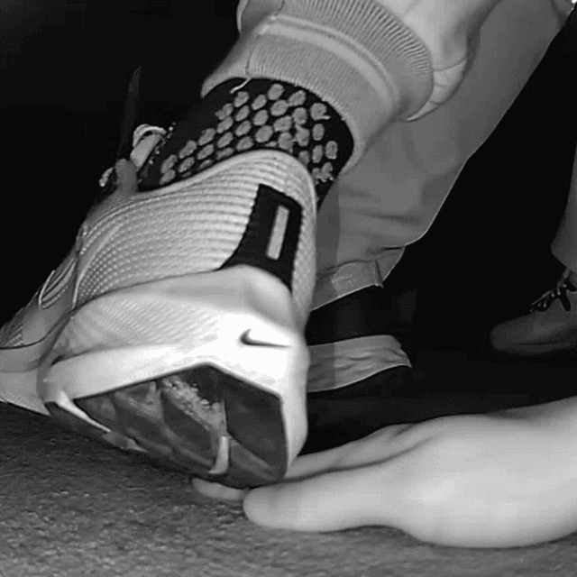 Young woman unaware hand trample with Nike running shoes in cinema 2