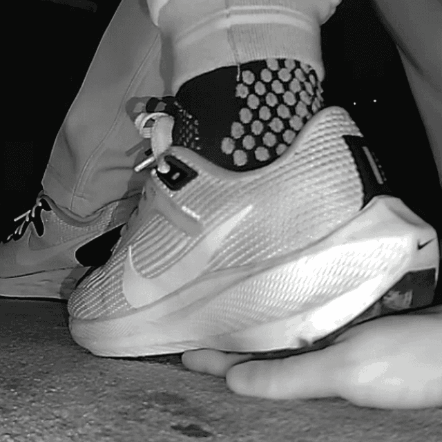 Young woman unaware hand trample with Nike running shoes in cinema 1