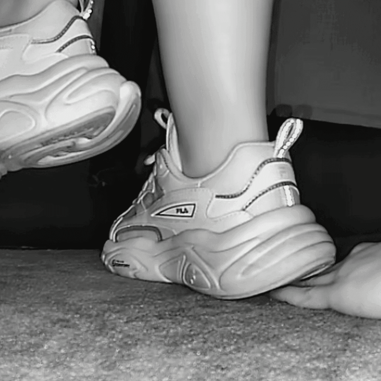 Woman wearing fila sneaker unaware hand trample in cinema thumb 2
