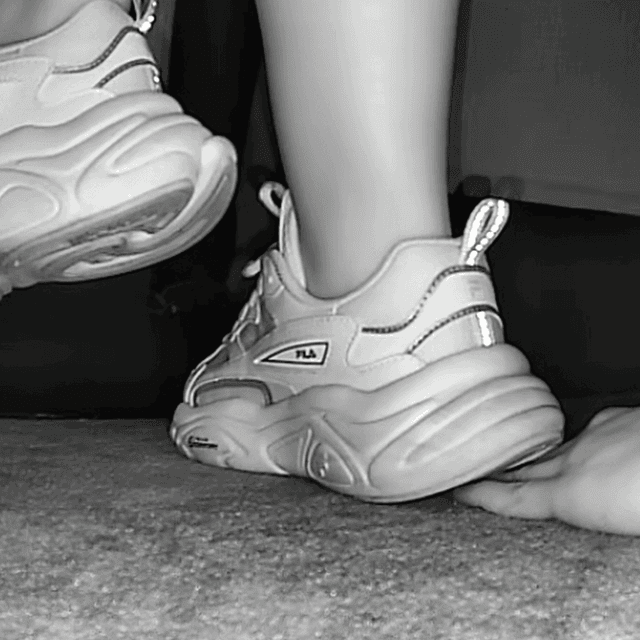 Woman wearing fila sneaker unaware hand trample in cinema 2