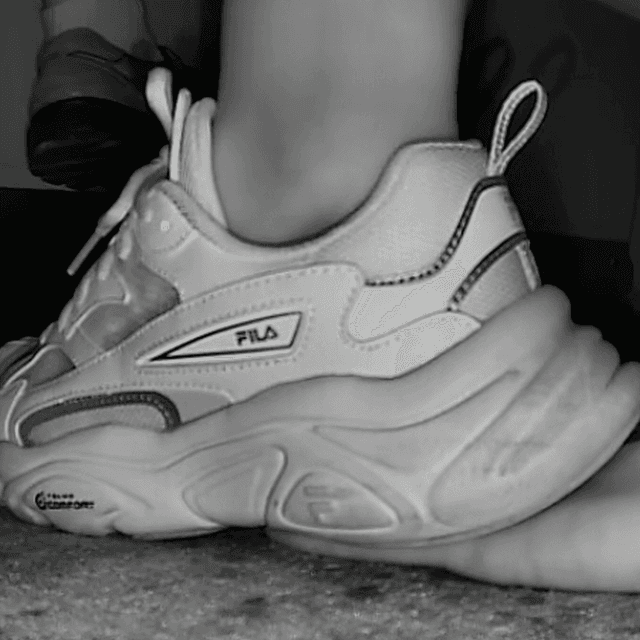 Woman wearing fila sneaker unaware hand trample in cinema 1