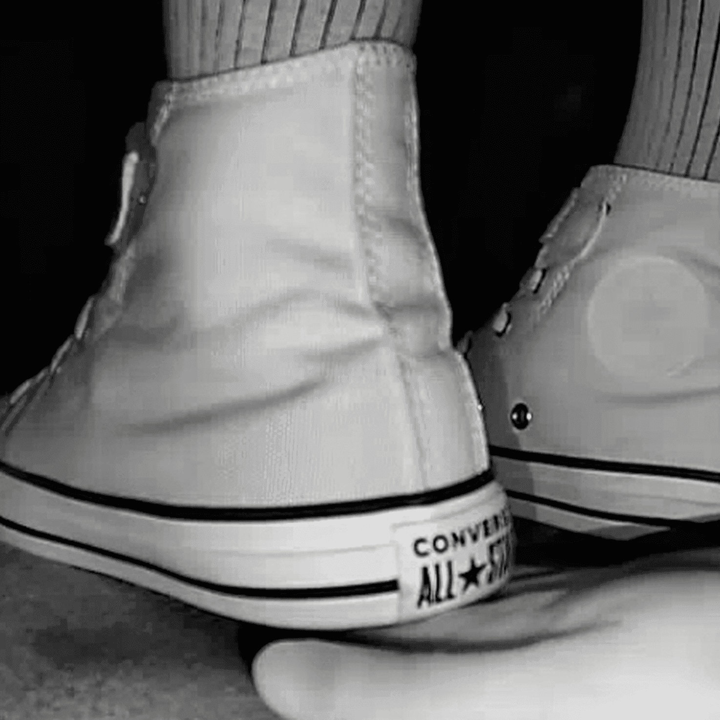 Woman black Converse shoe + Vans unaware hand trample in cinema thumb 2
