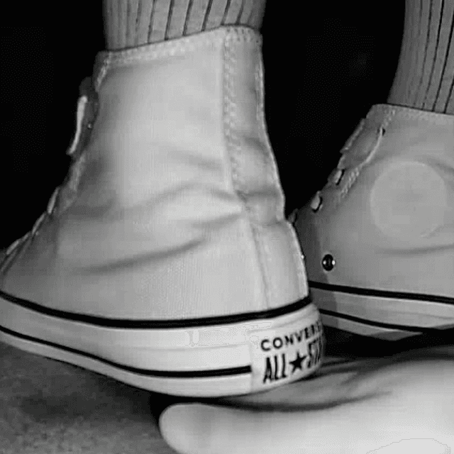 Woman black Converse shoe + Vans unaware hand trample in cinema 2